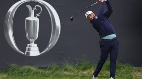 Jon Rahm reacts after Open fan whistles during tee shot