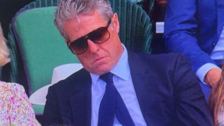 Hugh Grant seemingly caught sleeping during Novak Djokovic’s Wimbledon match