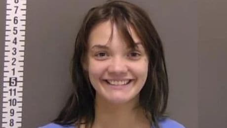 Woman smiles widely after ‘slashing her sleeping boyfriend with hatchet’