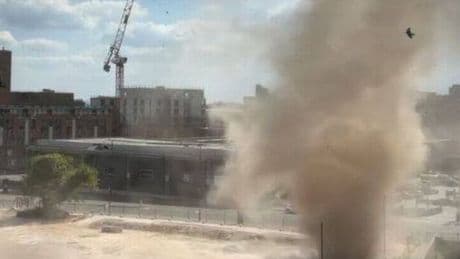 Tornado fears as 30m-high 'dust devil' tears through major UK city centre