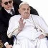 Pope Francis makes surprise appearance and seems in improved health as he is wheeled round St Peter's Square for Palm Sunday Mass