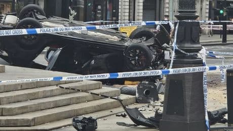 Car flips over and smashes into Piccadilly Circus fountain causing traffic chaos