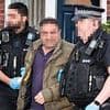 Nine arrested in dawn police raids after neo-Nazis 'hold birthday party for Adolf Hitler with swastika flags and birthday cake in pub'