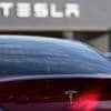 Tesla under investigation after parents say faulty door handles trapped their kids in the back