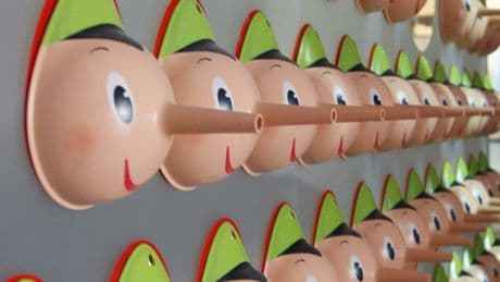 A fact checker hangs up his Pinocchios