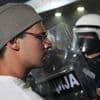 Tear gas fired at thousands of protesters in Serbia demanding free elections, justice