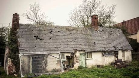 Eerie abandoned Crooked Cottage with records waiting to be played and food in cupboards