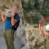 KIJK. Jongen gooit al lachend grote rots van klif in Spanje… en kan zich verwachten aan peperdure boete