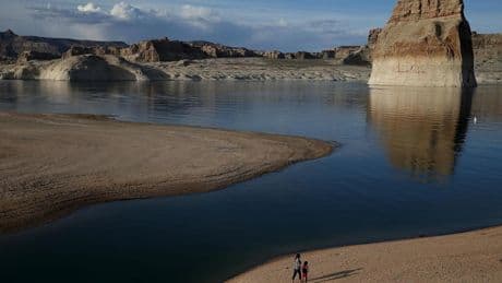 Low water levels at popular beach reveals truck containing human remains