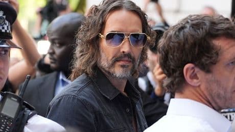 Russell Brand arrives at court to face rape and sexual assault charges