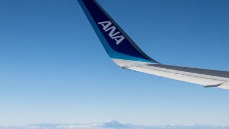Plane forced to land in Seattle after passenger tries to open exit door mid-flight, police say