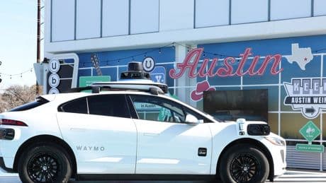 Uber's robotaxi chief says the company will still need human drivers, but their jobs will look very different