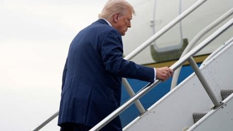 Trump stumbles on steps up to Air Force One