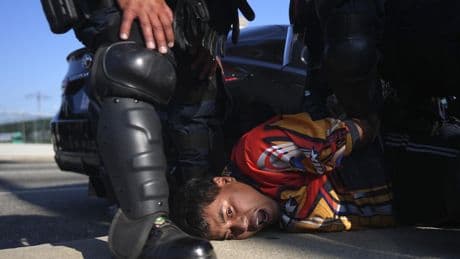 Police arrest more than 20 people on first night of curfew aimed at protests in downtown Los Angeles