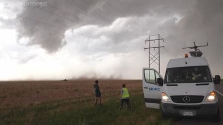 Watch as storm chasers drive into the heart of a huge hailstorm