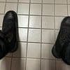 Classroom killer's final photos: Cat-obsessed gunman posted photograph of his FEET inside school bathroom cubicle moments before killing ten - and also took pictures of weapons he used