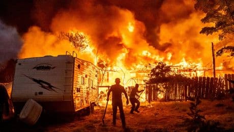 A wildfire sweeps through a historic California gold-mining town in photos