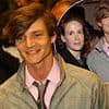 Hollywood heartthrob starring in one of this summer's biggest blockbusters looks unrecognisable in throwback snaps - Can YOU spot who he is?
