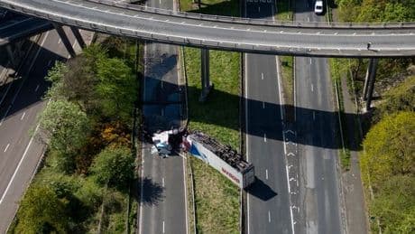 Lorry plunges from motorway bridge and lands upside-down on dual carriageway