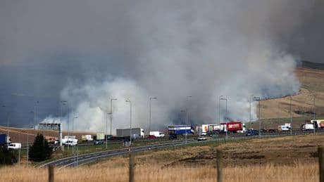 Major roads CLOSED as firefighters battle moors blaze STILL raging near motorway as thousands of drivers urged stay away