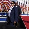 Secret Service agent suspended over Trump assassination attempt is unmasked... as widow of firefighter killed blasts agency