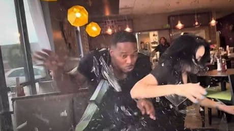 Influencers 'inches from death' after car slams into restaurant during live food review
