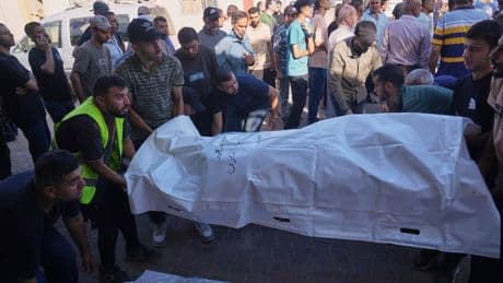 Strikes across Gaza kill at least 31 as international scholars accuse Israel of genocide