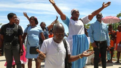 Thousands of Haitians mark annual pilgrimage far from a sacred waterfall surrounded by gangs