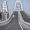 Ukraine attacks Putin's prized Kerch bridge to Crimea in daring underwater strike with TNT blasts leaving it 'in a state of disrepair' days after drones blitzed nuke bomber fleet