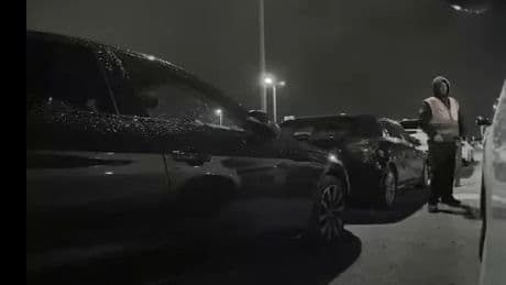 Shock moment brazen Manchester Airport worker WEES on driver’s Range Rover in long-stay carpark