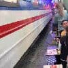 Tourist almost run over while taking photo of train at popular sightseeing spot