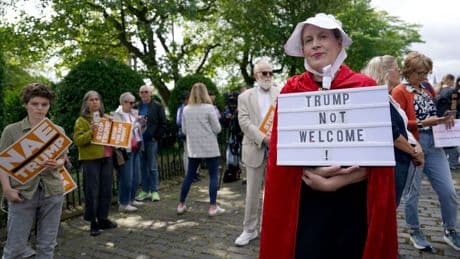 Photos: Protesters rally with bagpipes and pointed signs as Trump visits Scotland