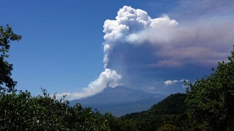 Mount Etna erupts, sending huge plume of ash into sky and tourists fleeing