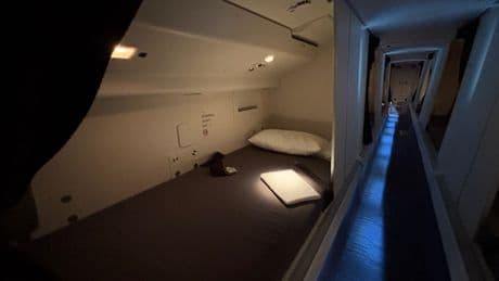 See inside the hidden area where Qatar Airways flight attendants sleep on long-haul Boeing 777 flights