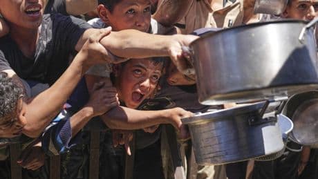 At least 60 people killed by Israeli strikes in Gaza as Israel lets minimal aid in