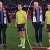Footy fan suffers embarrassing moment during important pre-game formality