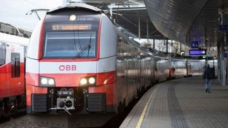 Man clings onto high-speed train for dear life as he's caught out while smoking