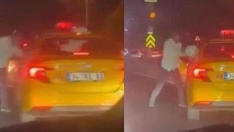 Kaskla taksinin camını kırmaya çalıştı! Trafikte 'Yol verme' kavgaları kamerada