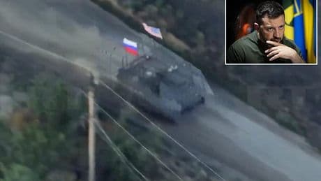 Russian troops taunt Zelensky by flying US flag on captured American armoured vehicle during frontline assault ahead of Ukrainian leader's crunch talks with Trump today