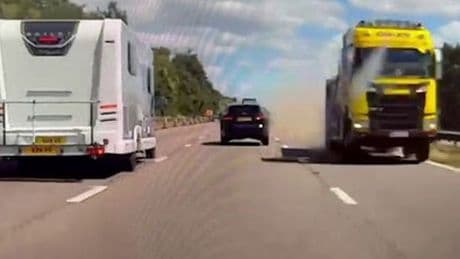 Lorry speeds down wrong side of motorway inches from head-on smash