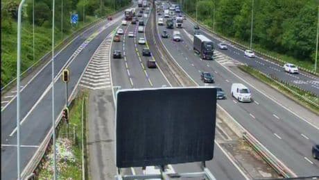Eight-car pile up leaves biker fighting for life after major motorway SHUT for 7 hours and cops probing crash