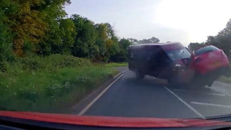 Moment wrong-way minibus driver smashes head-on into car