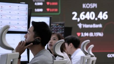 Asian shares mostly lower, trading in a narrow range with US markets closed for Memorial Day
