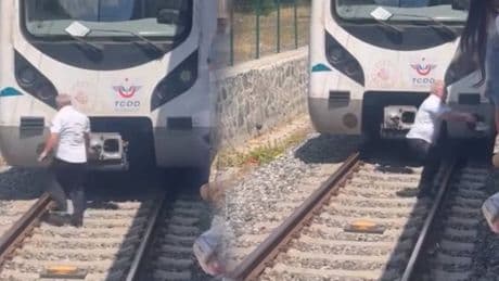 Raylara düşen kediyi kurtarmak için treni durdurdu, raylara indi