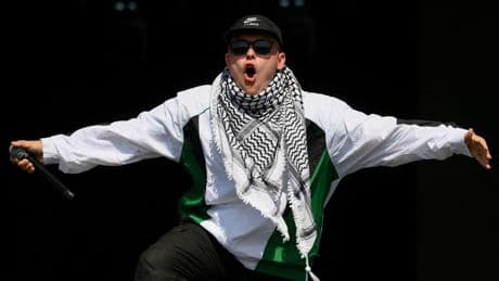 Kneecap rapper says he's a 'free man' as band draw huge Glastonbury crowd