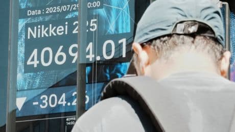 Asian shares mostly slip as focus shifts to US talks with China