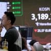 Asian shares are mixed after Nvidia nudges Nasdaq to a record, while other US stocks slump