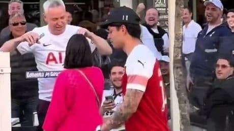 Moment bold Arsenal fan bombarded with X-rated chant from Spurs supporters after strolling around Bilbao in Gunners kit