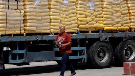 US-backed group says it has begun Gaza aid distribution after director quits over independence fears