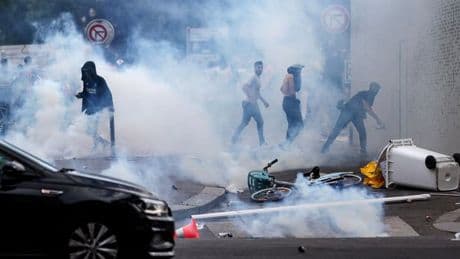 Armed riot police clash with PSG fans at Champions League parade on second day of chaos